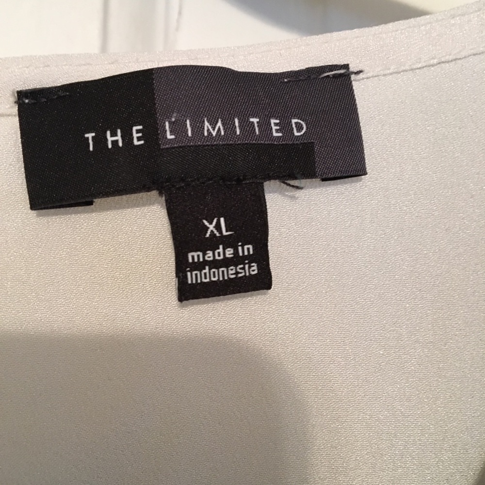 Black and white sleeveless blouse